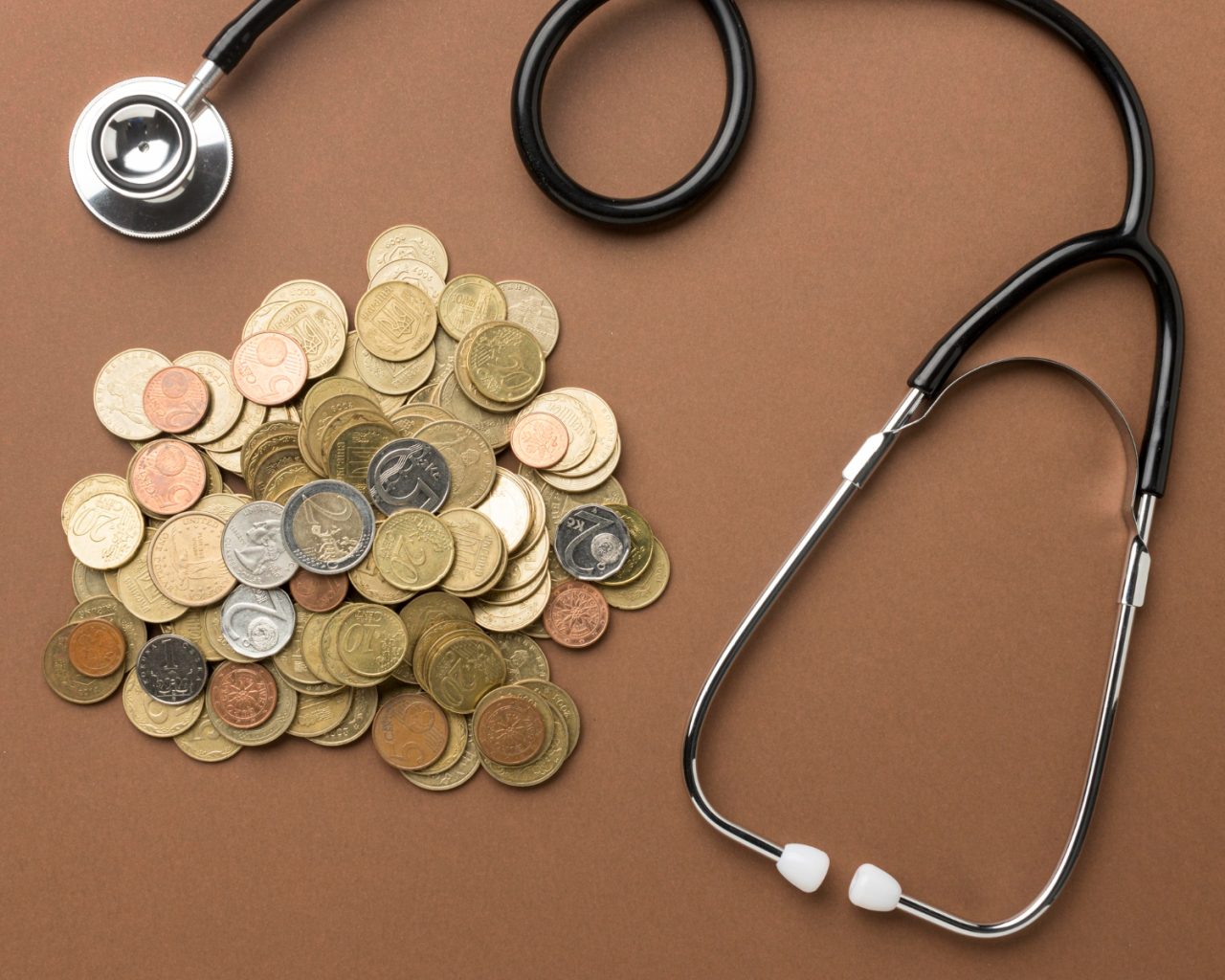 bunch coins arrangement with stethoscope